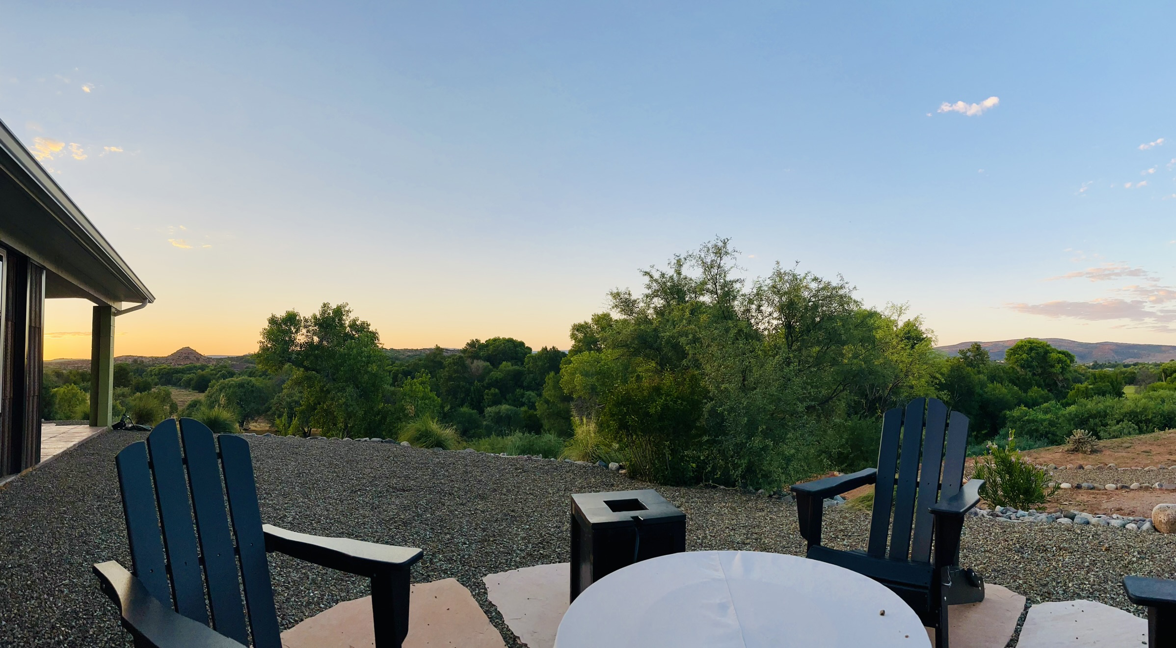 Sunset view from the deck with Adirondack chairs and fire pit overlooking Verde Valley