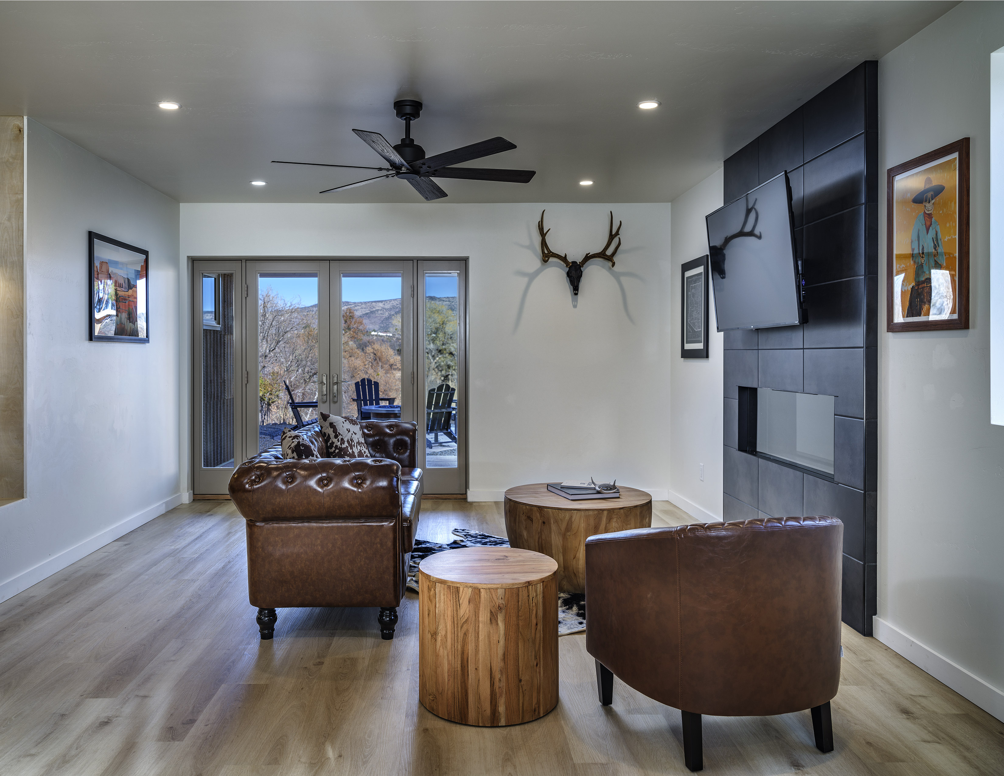 Pitchner Place — living room with leather Chesterfield chairs and valley views