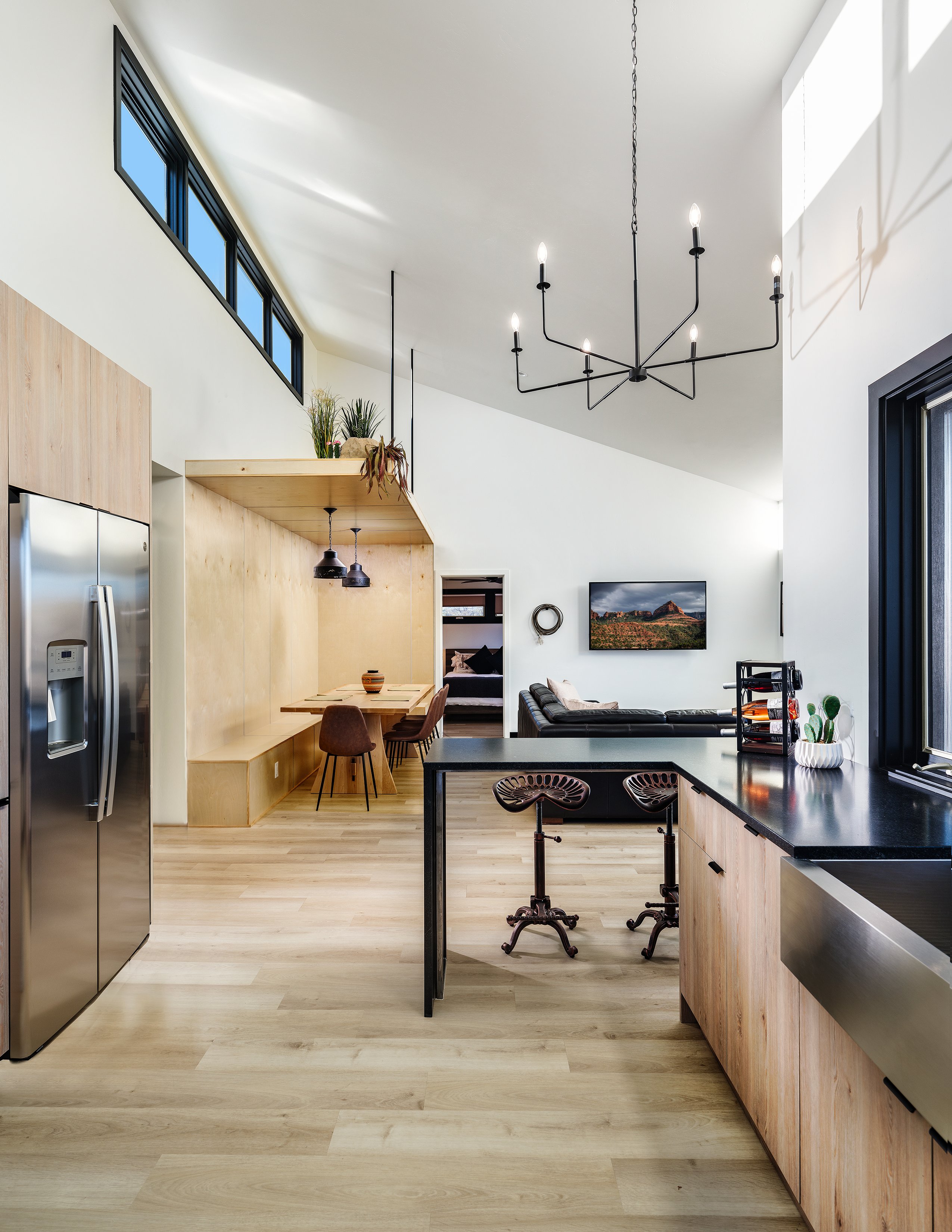 Gourmet kitchen with elk antler mount, wood cabinets, and windows overlooking greenery